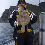 team poseidon i söröya - 2011 med en rödspätta i fisketidningen